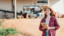 Young farmer holding a notebook