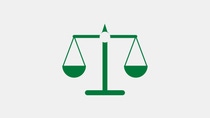 Green icon of a balance scale symbolizing equality and shared value.  Green icon of a balance scale symbolizing equality and shared value.