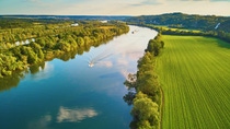 Scenic aerial view of the Seine river and green fields in French countryside. Val d'Oise department, Ile-de-France, Northern France; Shutterstock ID 1898268388; purchase_order: 1086744798; job: Annegret Liebscht; client: APB/KS; other: 20782208 Scenic aerial view of the Seine river and green fields in French countryside. Val d'Oise department, Ile-de-France, Northern France; Shutterstock ID 1898268388; purchase_order: 1086744798; job: Annegret Liebscht; client: APB/KS; other: 20782208