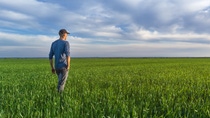 Farmer in the field with soil in hand Farmer in the field with soil in hand