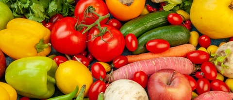 top view fruits and vegetables eggplant bell peppers apples carrot coriander cauliflower persimmon radish cherry tomatoes on blue background top view fruits and vegetables eggplant bell peppers apples carrot coriander cauliflower persimmon radish cherry tomatoes on blue background
