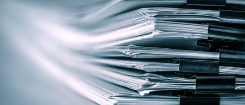 Extreamely close up a report paper stacking of office working document