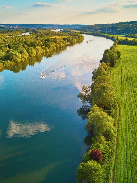 Scenic aerial view of the Seine river and green fields in French countryside. Val d'Oise department, Ile-de-France, Northern France; Shutterstock ID 1898268388; purchase_order: 1086744798; job: Annegret Liebscht; client: APB/KS; other: 20782208