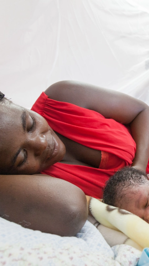 Namibia - Ondangwa Net Distribution: There are more than 200 million cases of malaria each year and almost half a million deaths. Infants, children under five and pregnant women are the most vulnerable groups. Elizabeth, with her infant son George (1 day old when shot was taken, 3.5kg). She followed advice from nurses at her prenatal scans that she should sleep under a net during pregnancy. As such she did not fall sick and the baby was born at full term. Photo James Patrick/BASF