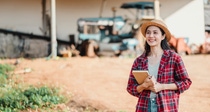 Young farmer holding a notebook Young farmer holding a notebook