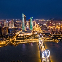 A picture of a skyscraper at night