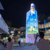 A picture of a skyscraper at night